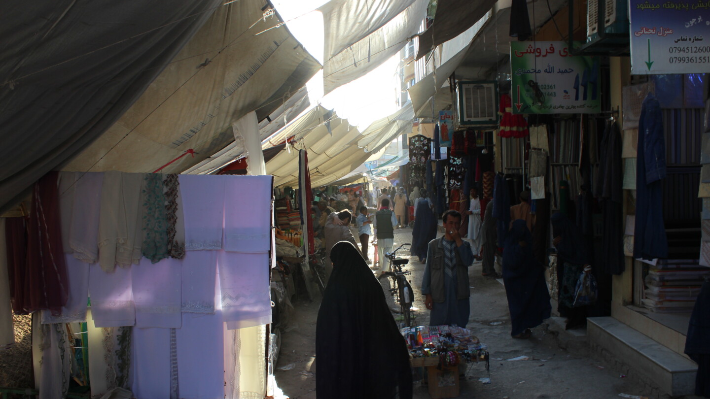 People at a city market, a woman in the foreground